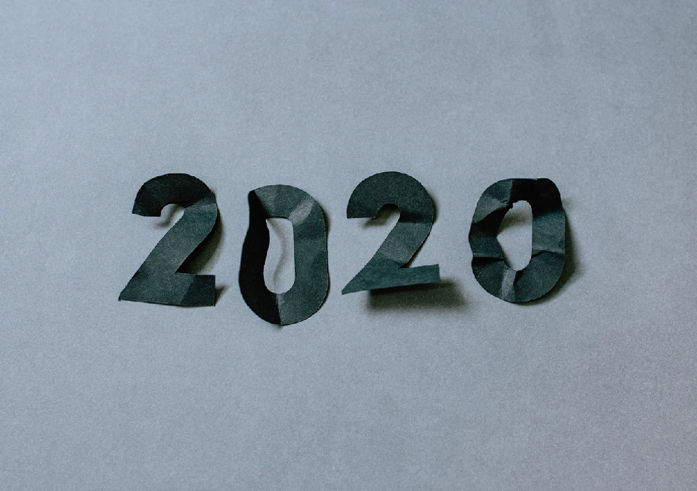 Crumbled paper laid out to read “2020”