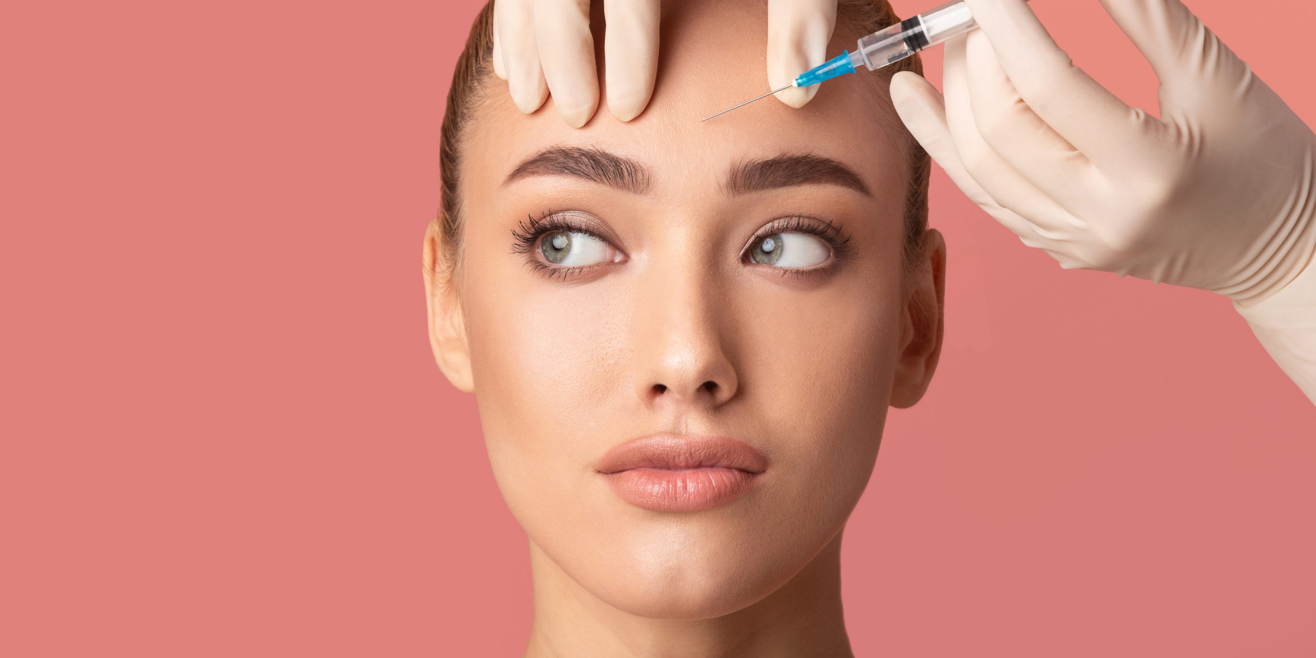 Woman having an injection in her face