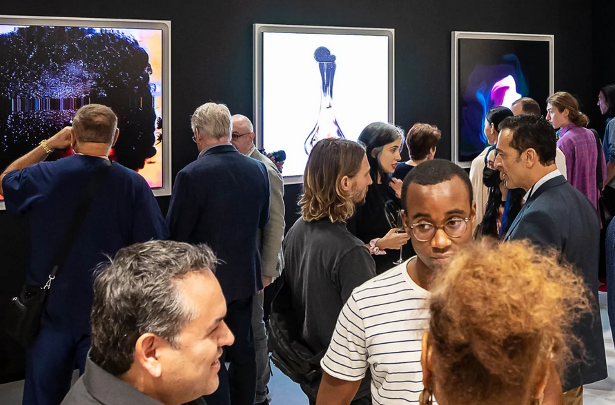 Attendees at an art gallery with Danvas frames