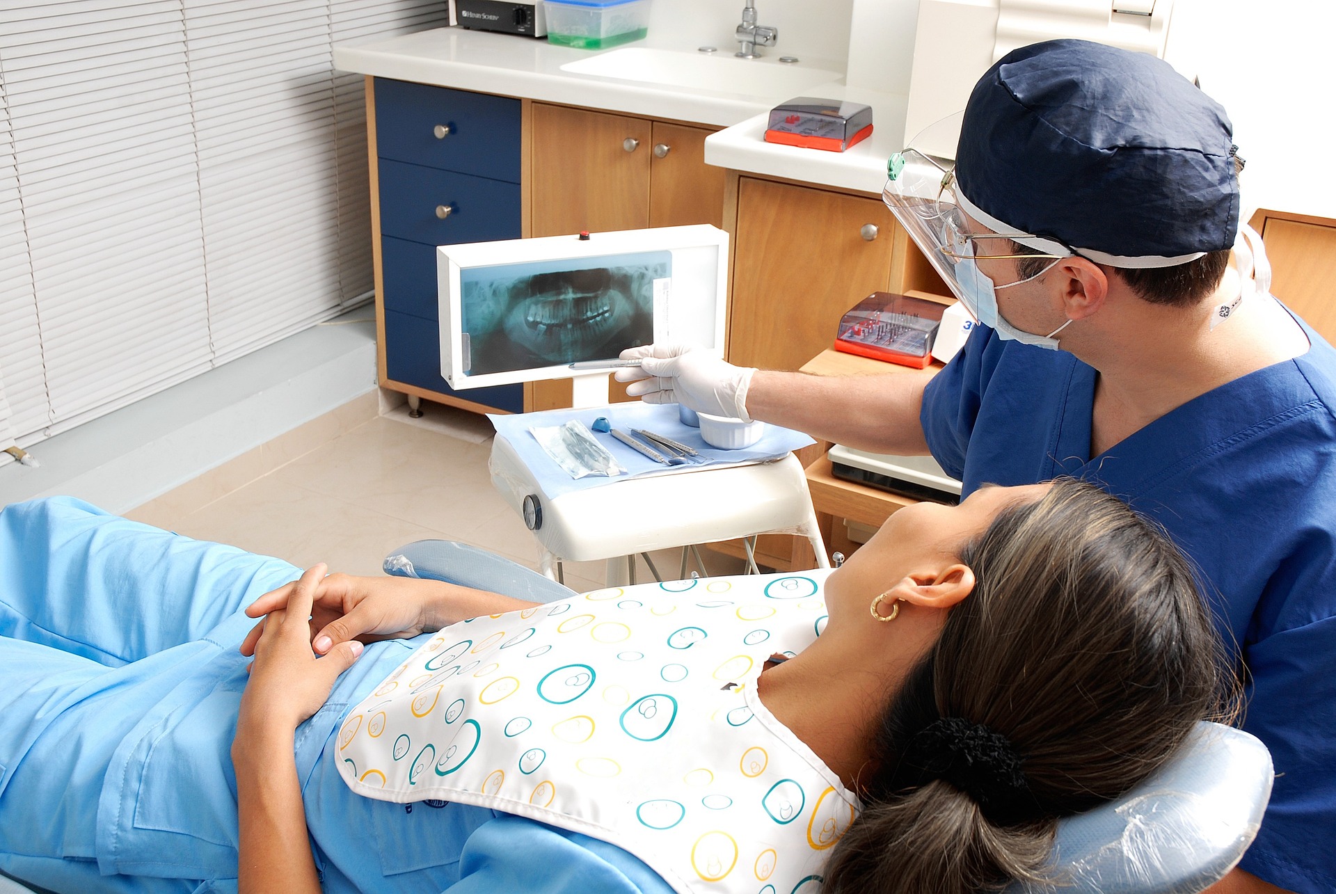 Dentist showing a patient her X-rays