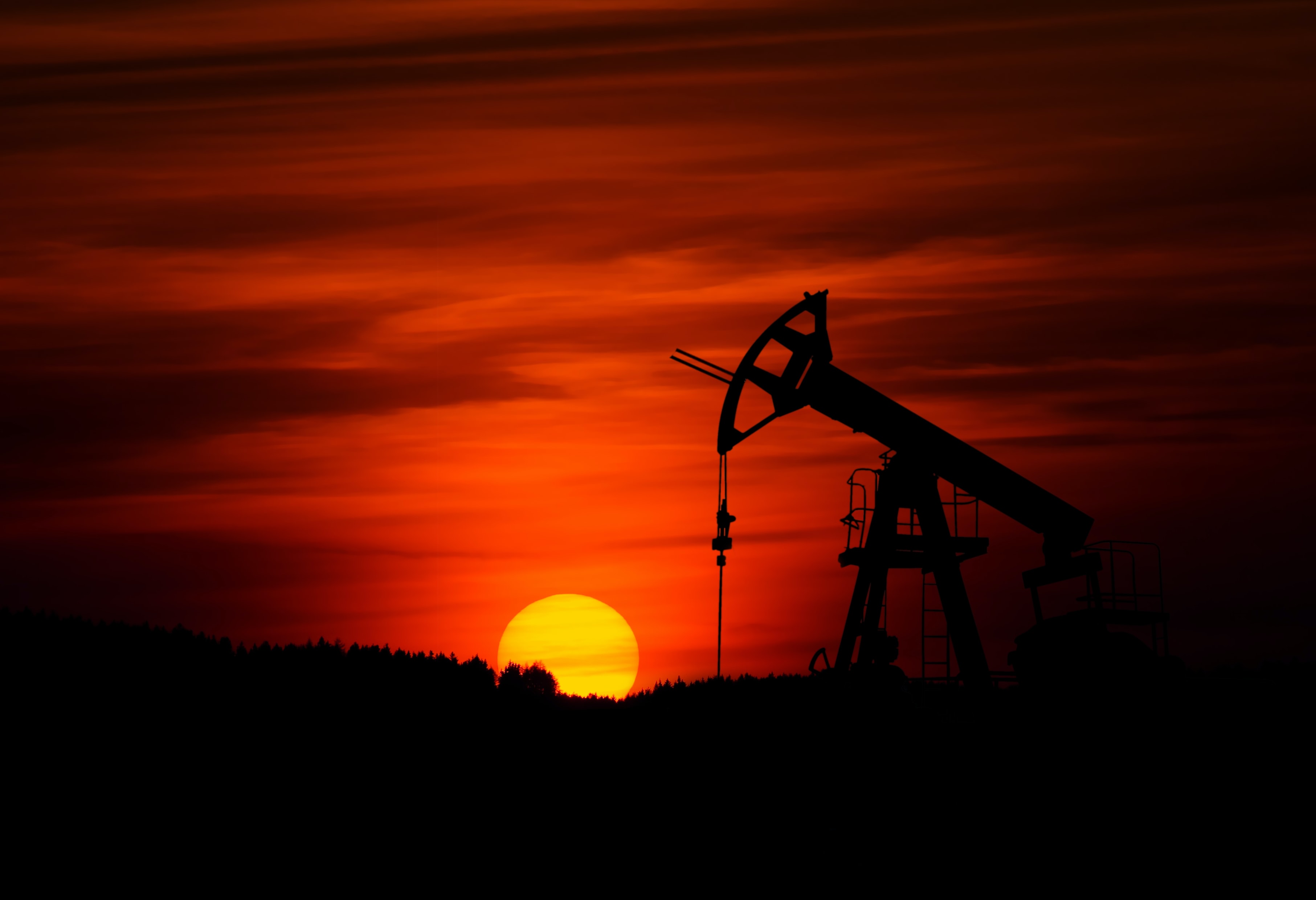 Oil pump next to sunset
