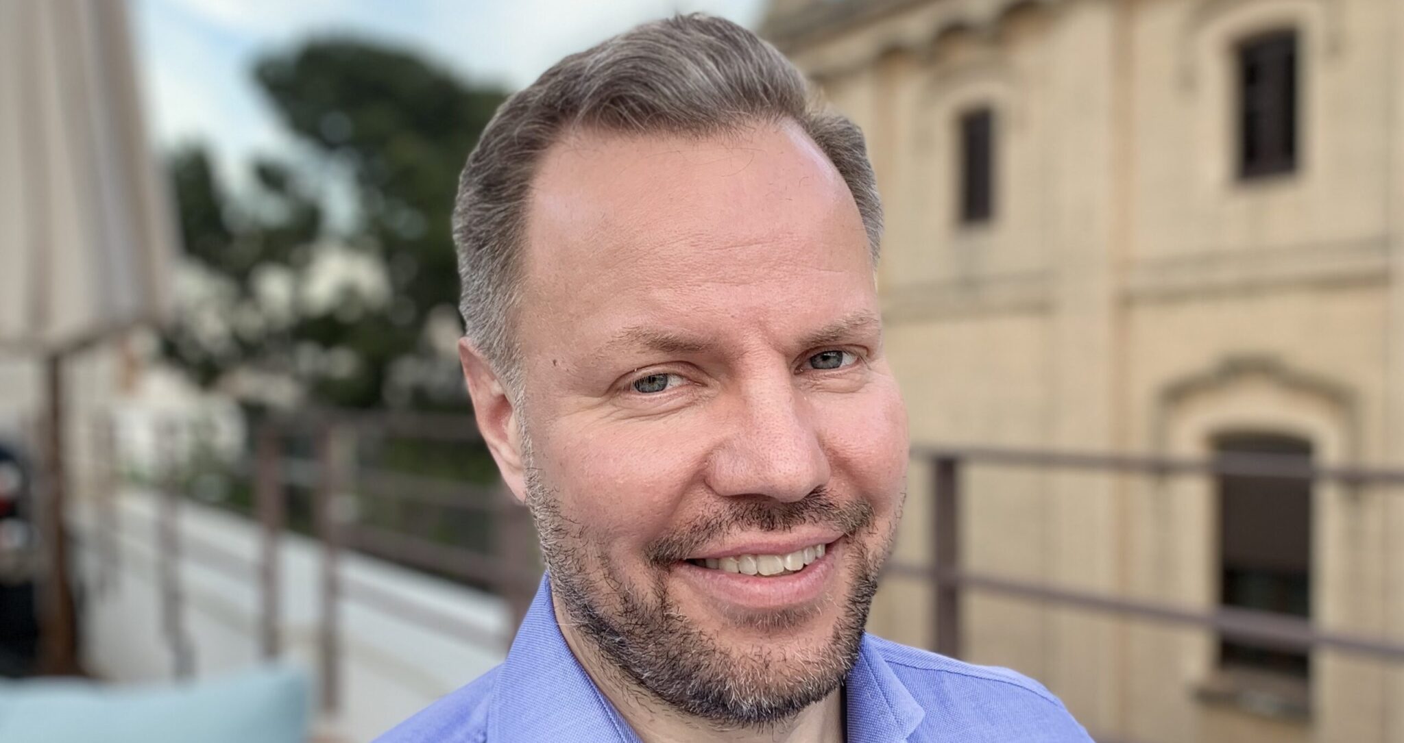 Jussi Lystimäki in front of railings