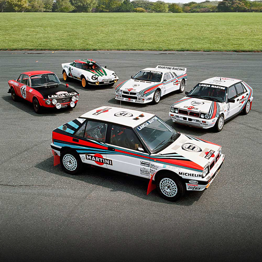 Selection of Lancia racing cars parked on a test track