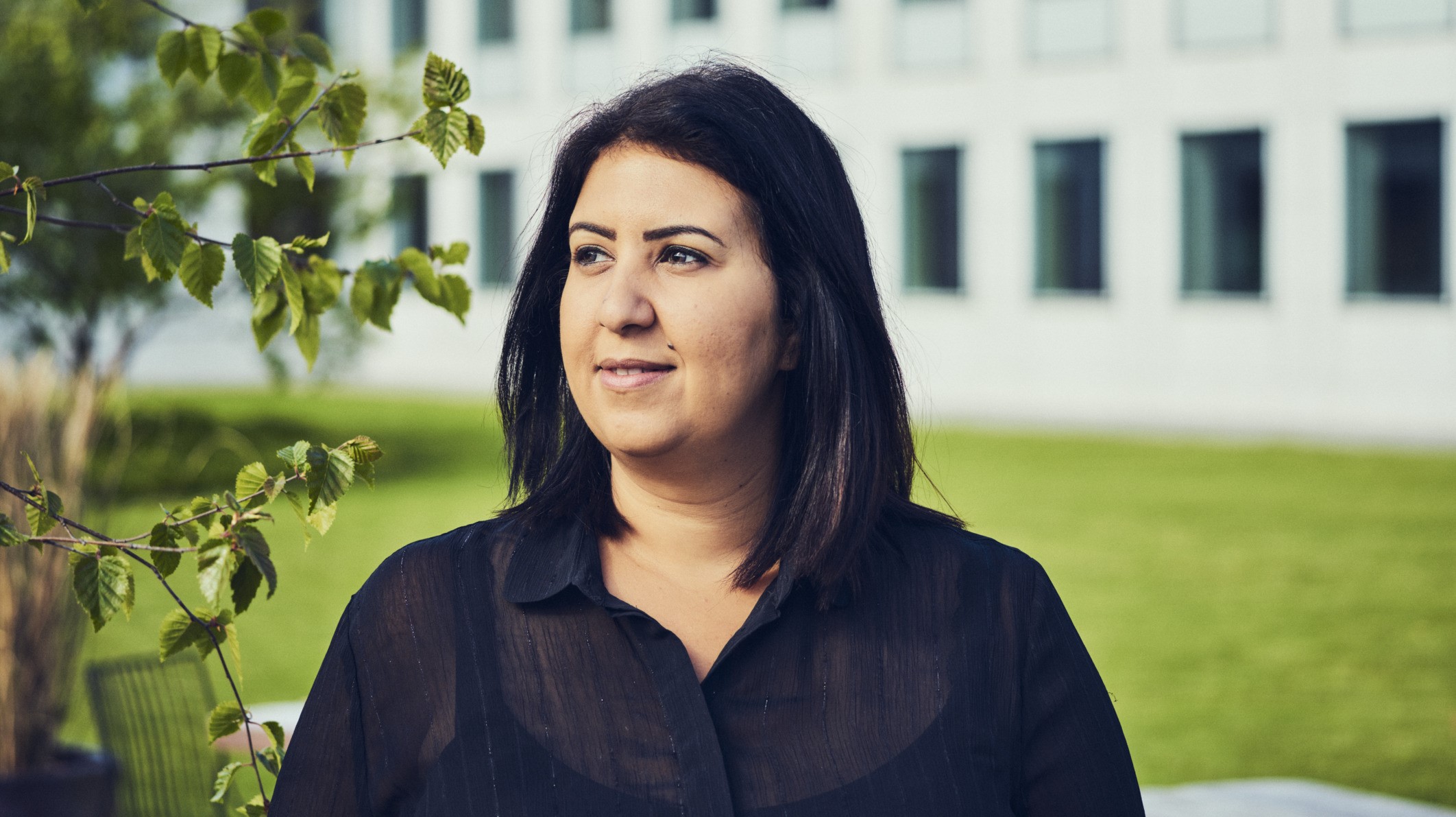 Photo of Shreen El Zarkani on grass in front of building