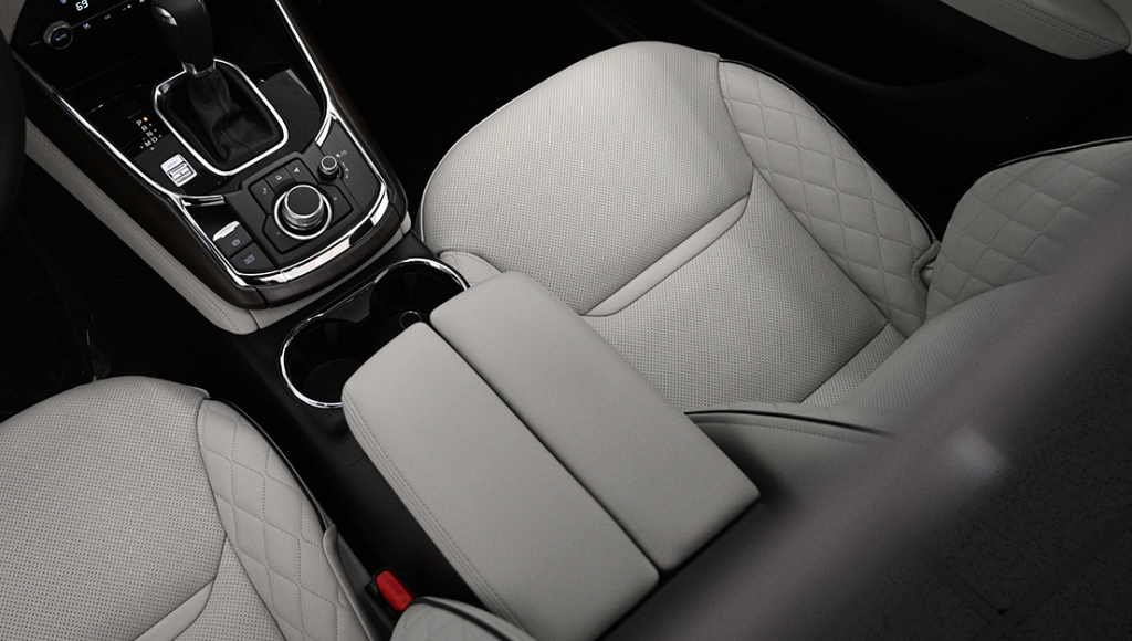 Aerial view of grey leather front seats in car