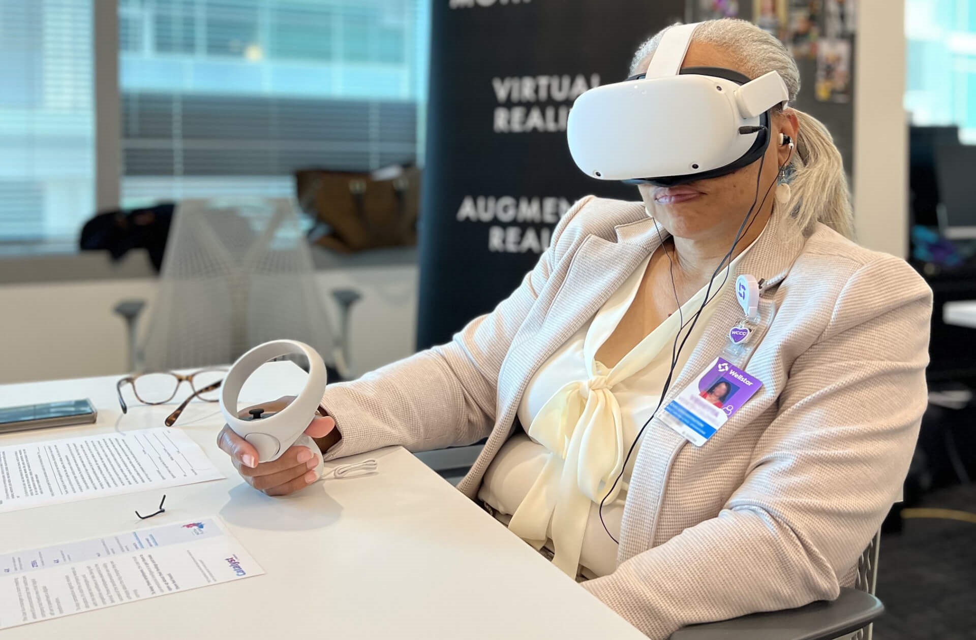 Female healthcare worker wearing Moth+Flame virtual reality device