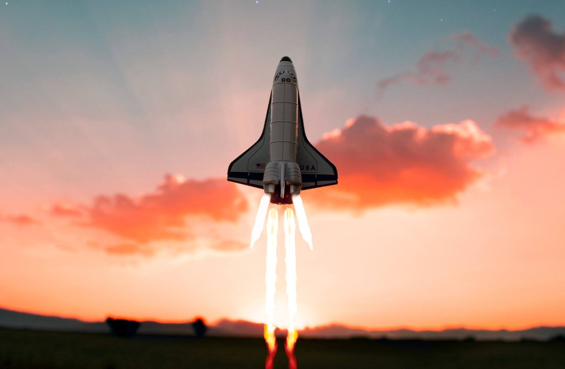 Rocket taking off at sunset