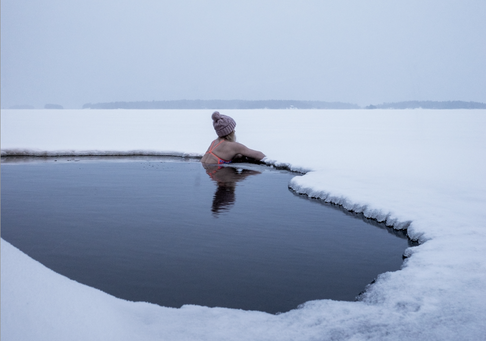 Swimmer in hole in the ice