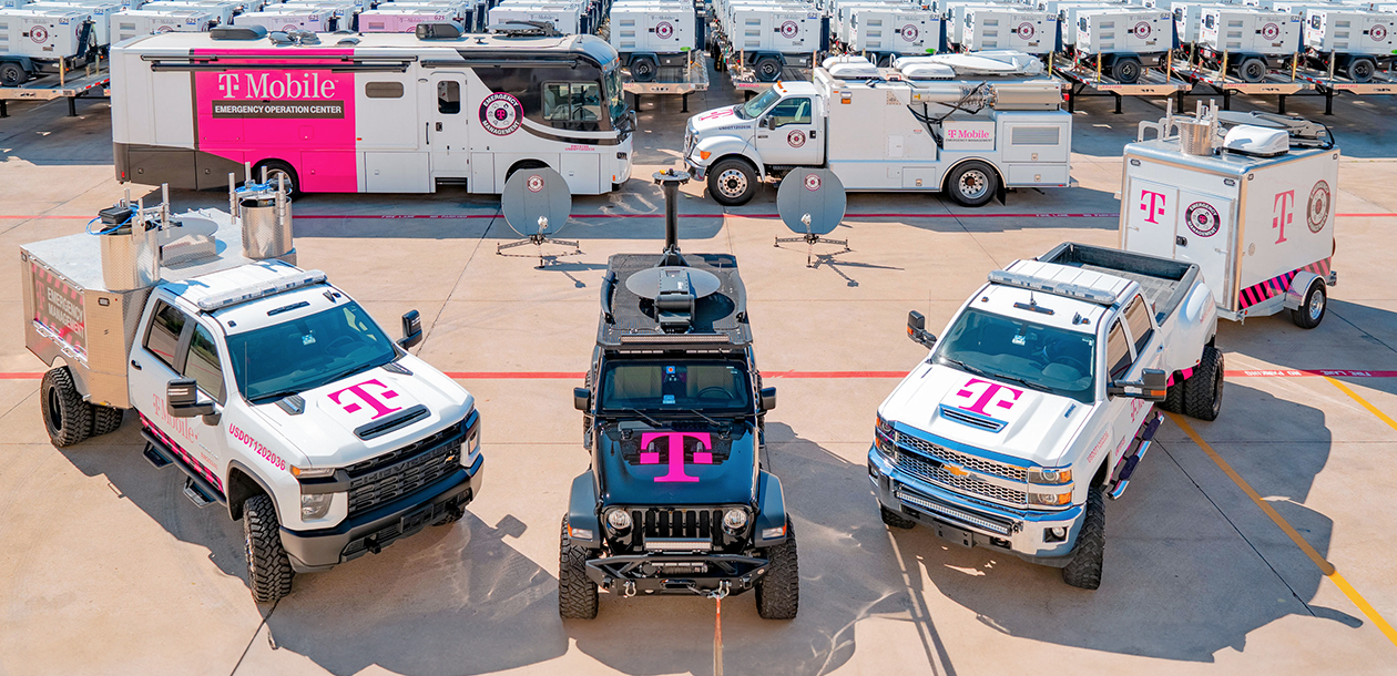 Parked trucks and jeeps with T-Mobile logo on
