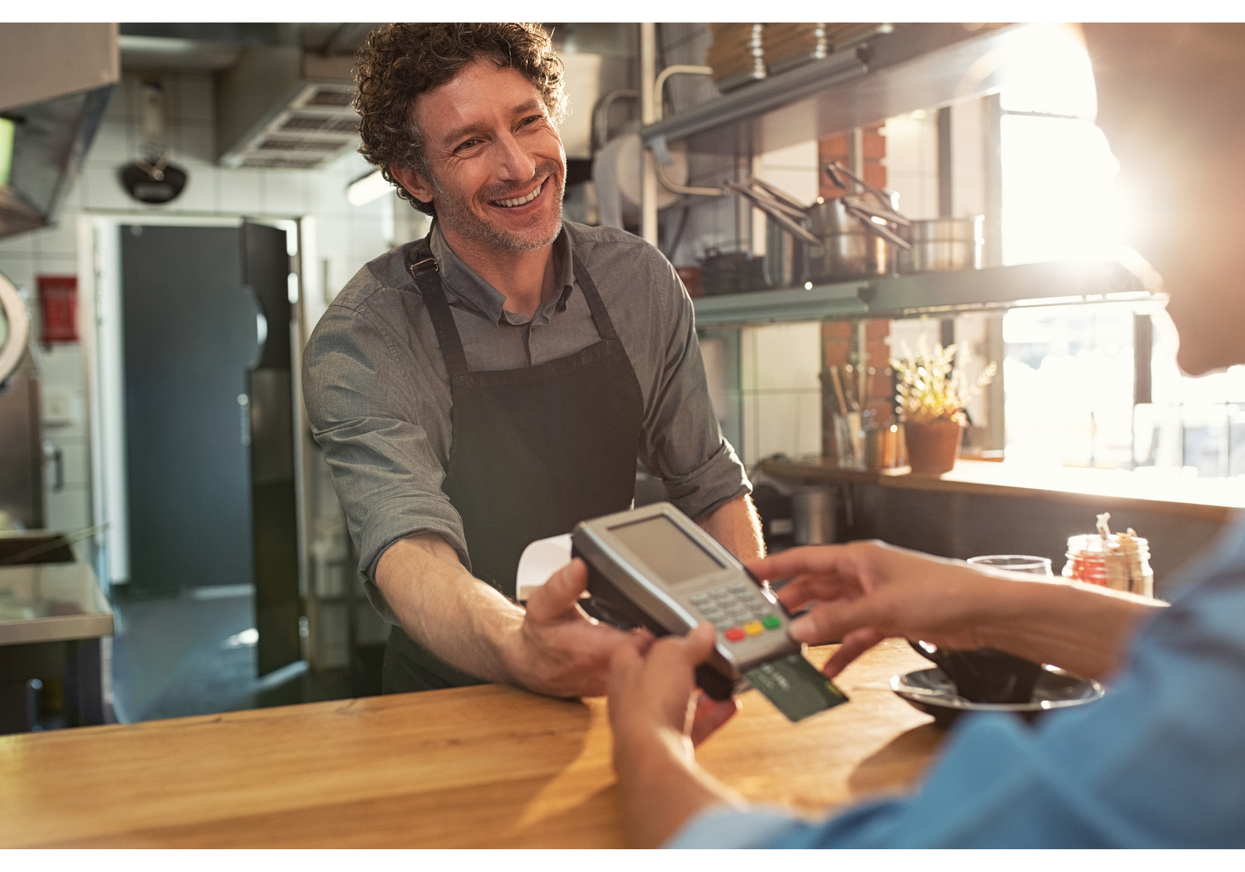 Waiter accepting card payment