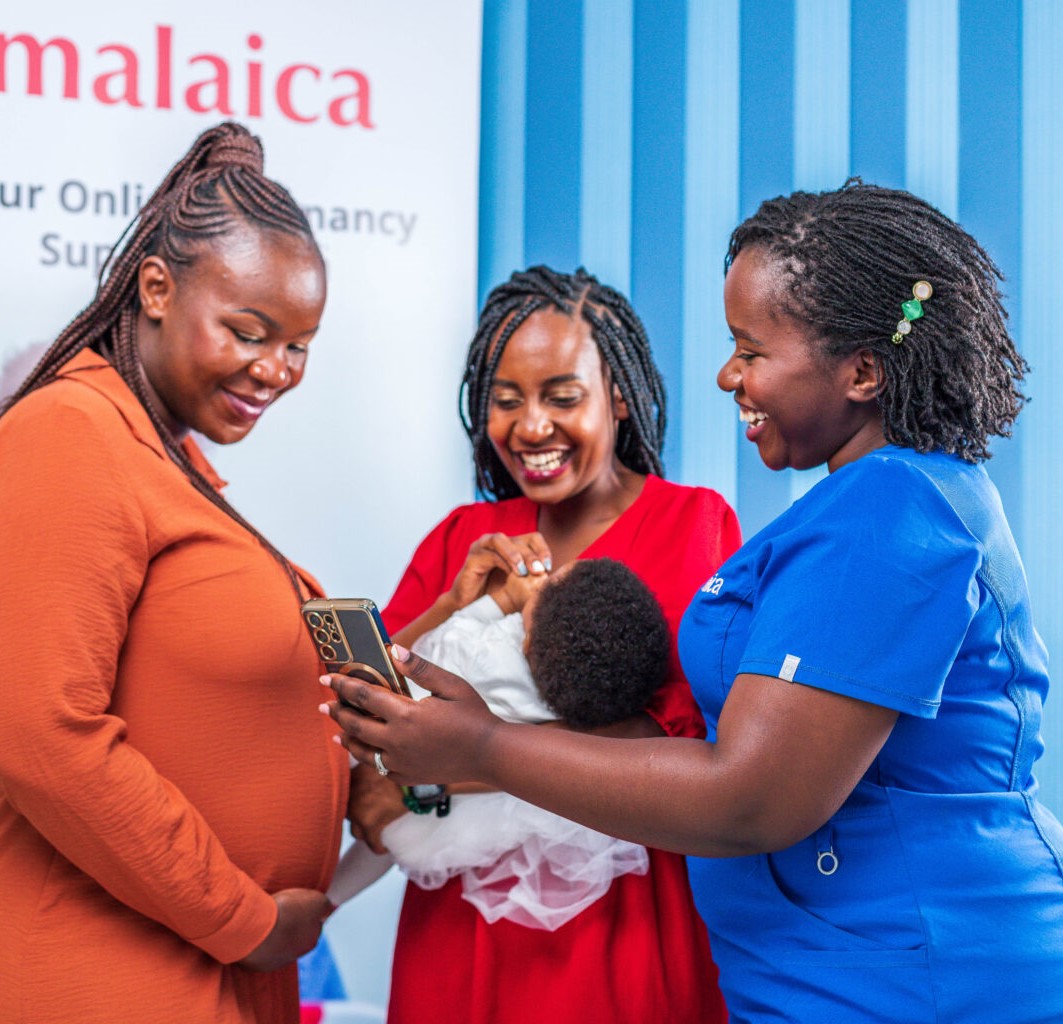 A nurse attends to a mother and pregnant woman