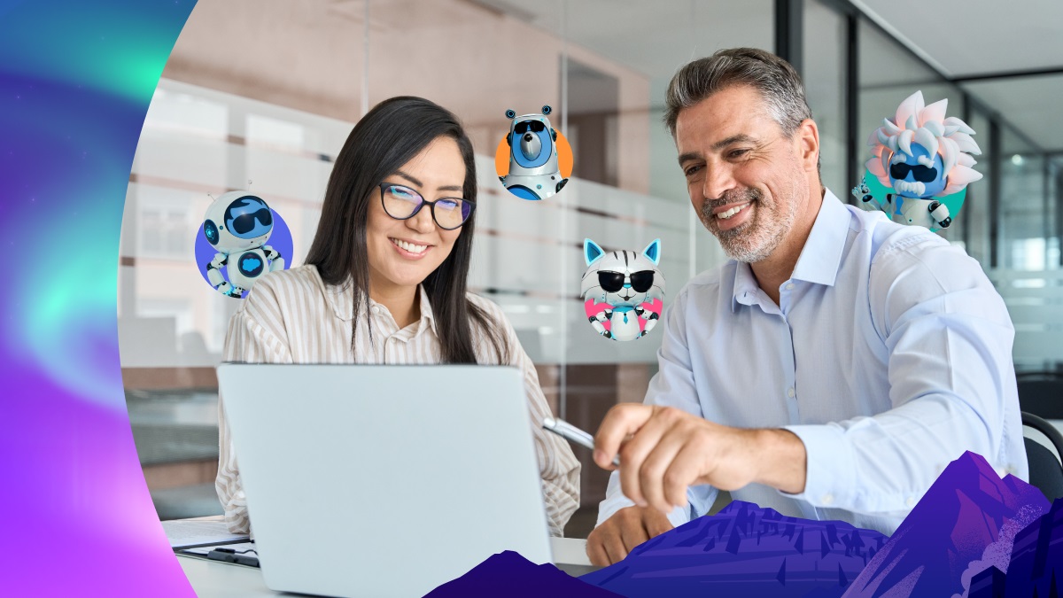 Two office workers smile at a laptop as cartoon figures hover around them