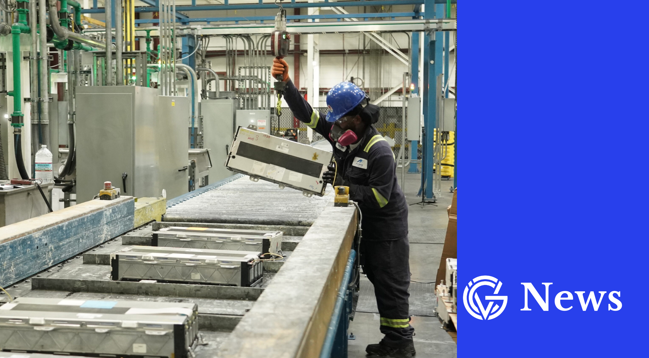A worker in hard hat takes a battery pack off an assembly line, in GCV news template