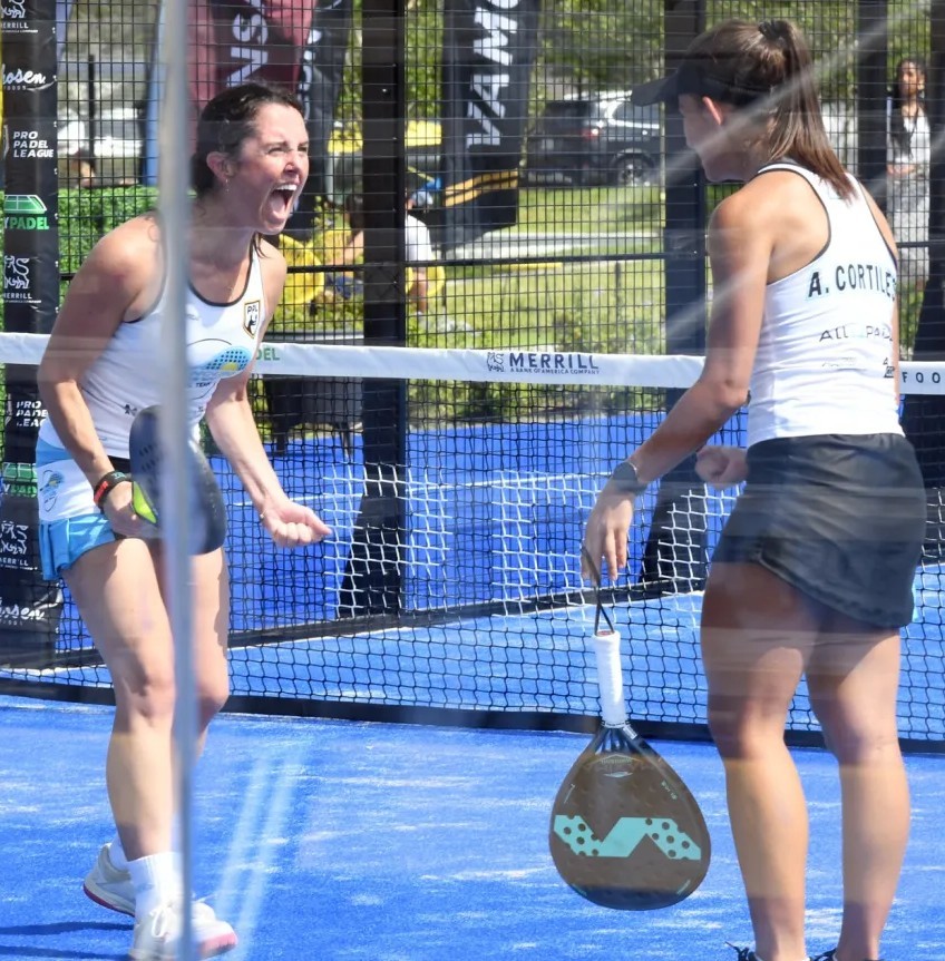 Two padel players celebrate a victory
