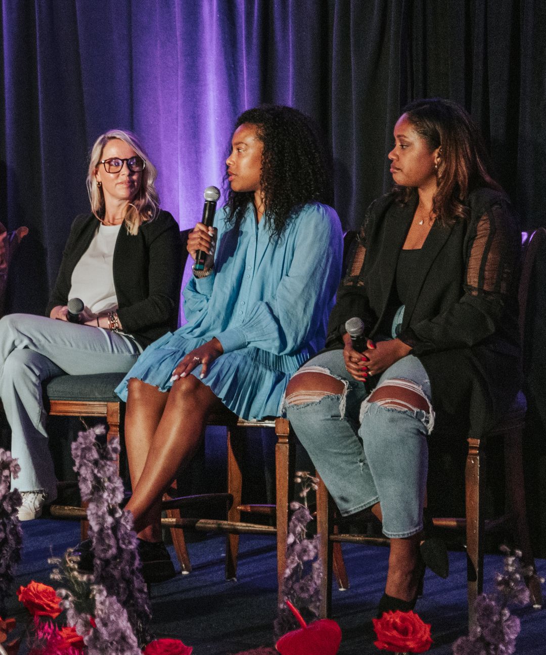 Three women seated onstage at a HearstLab pitch event
