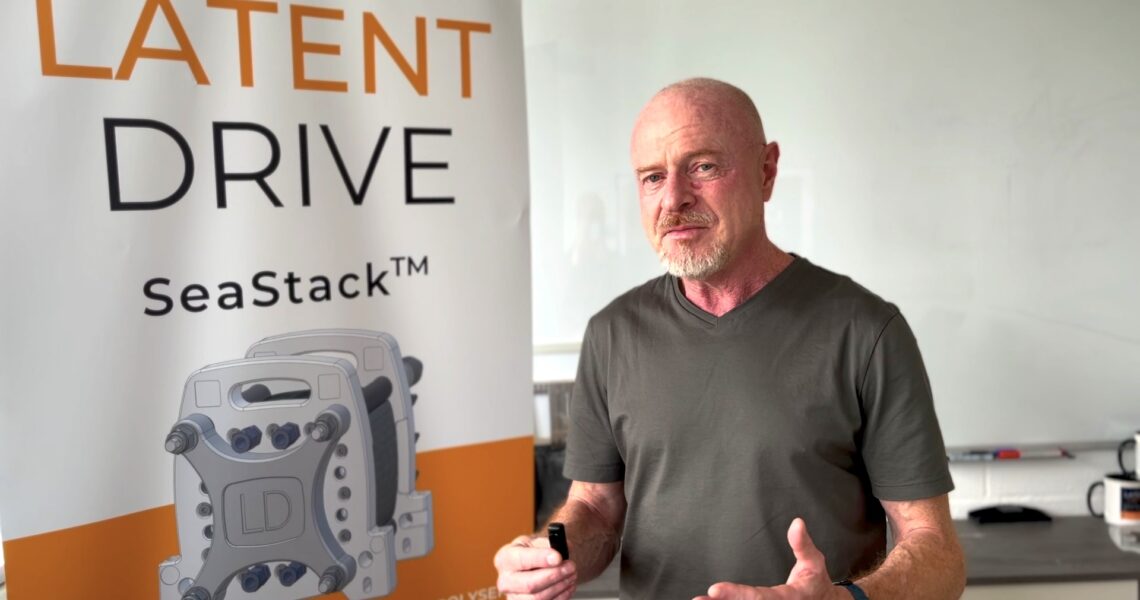 Latent Drive CEO next to a banner of its SeaStack technology. Image courtesy of Park Life on Tour