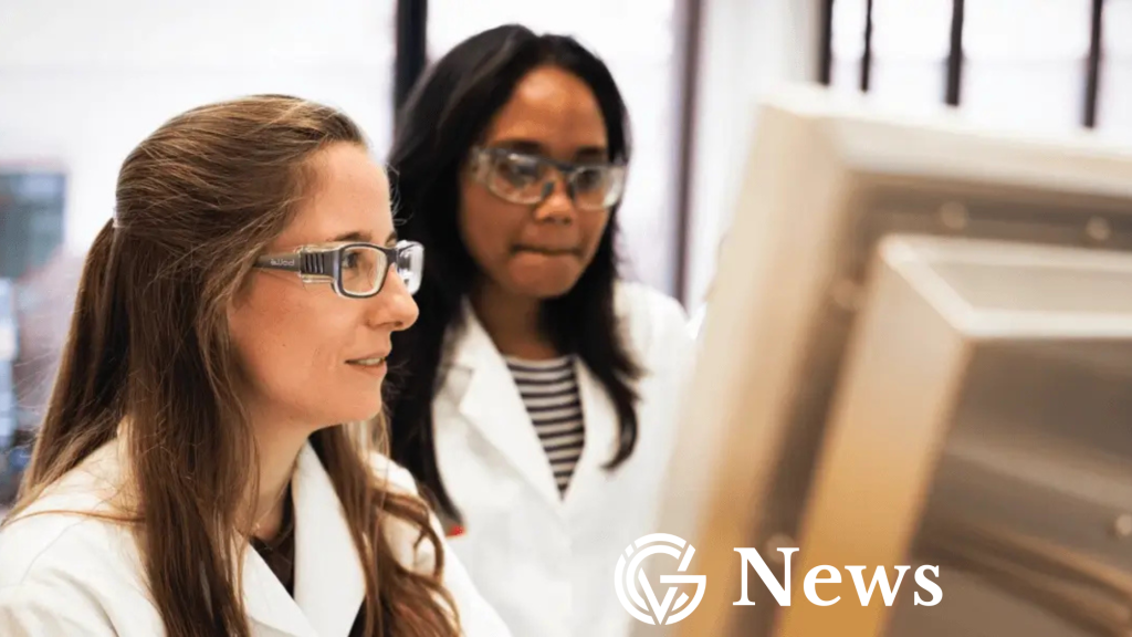 Sanofi scientists looking at a computer in the GCV News template