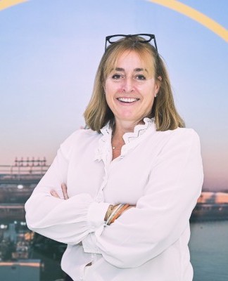 Roslyn Aird folding her arms in front of a skyline