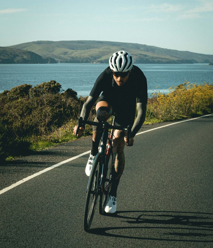 A man cycling down a mountain road