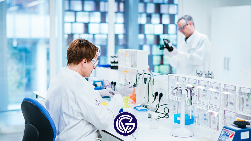 Servier scientists working in a lab, with the GCV logo on