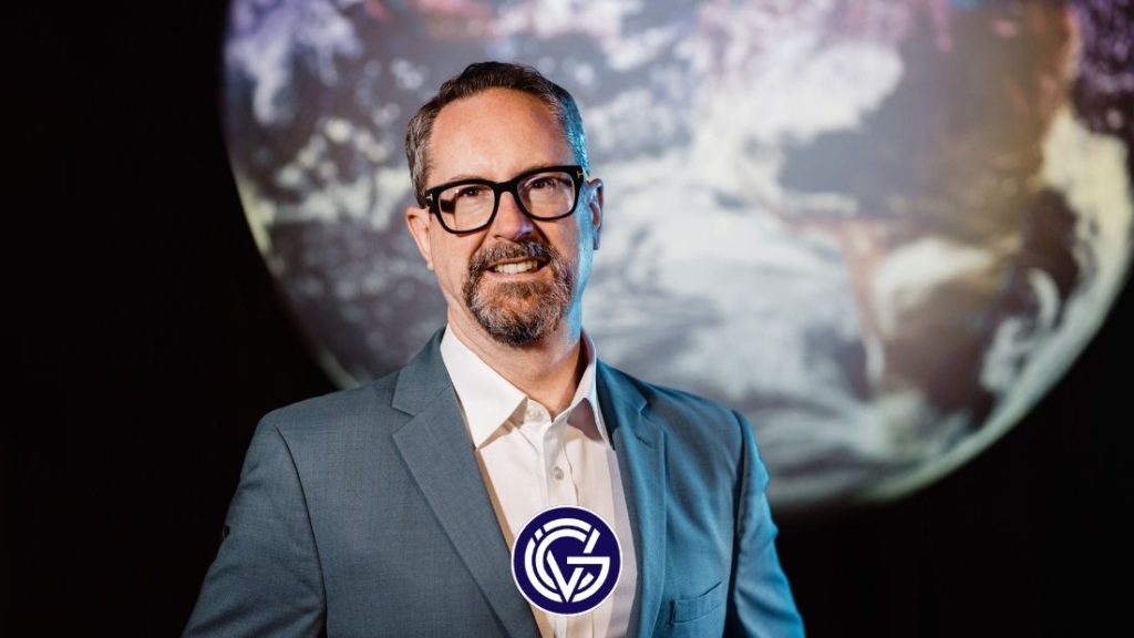 Mark Boggett of Seraphim Space with the Earth behind him